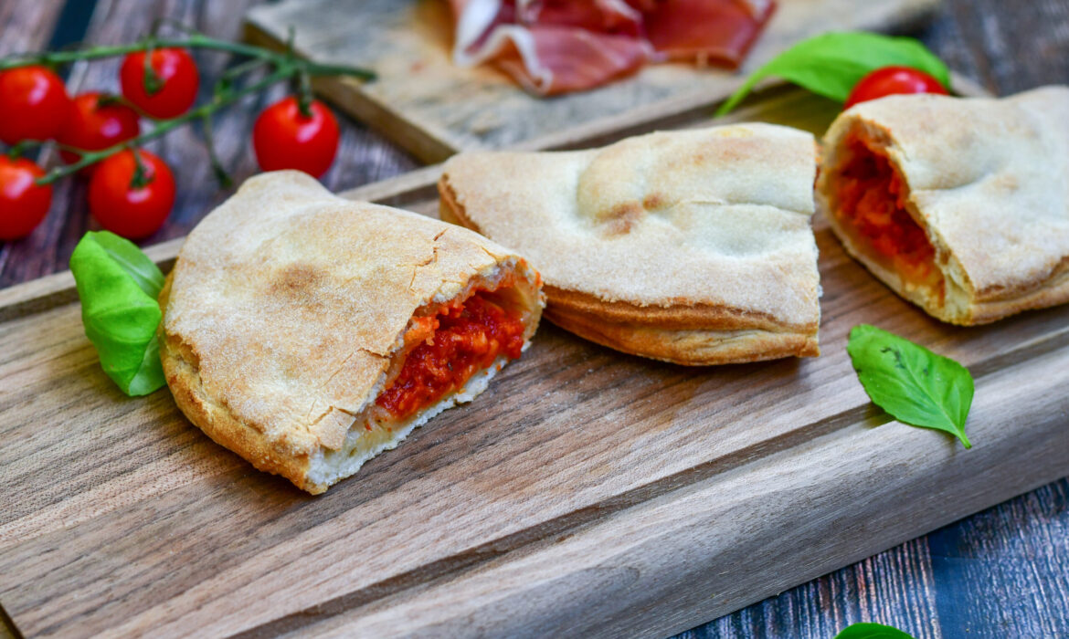 Home made italian calzone vegetarian  pizza with  tomatoes, mozz